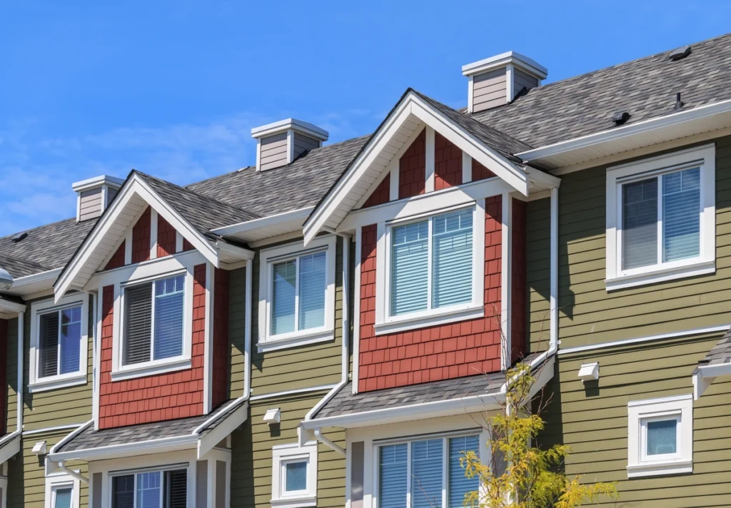 condos that are green with red accents around windows