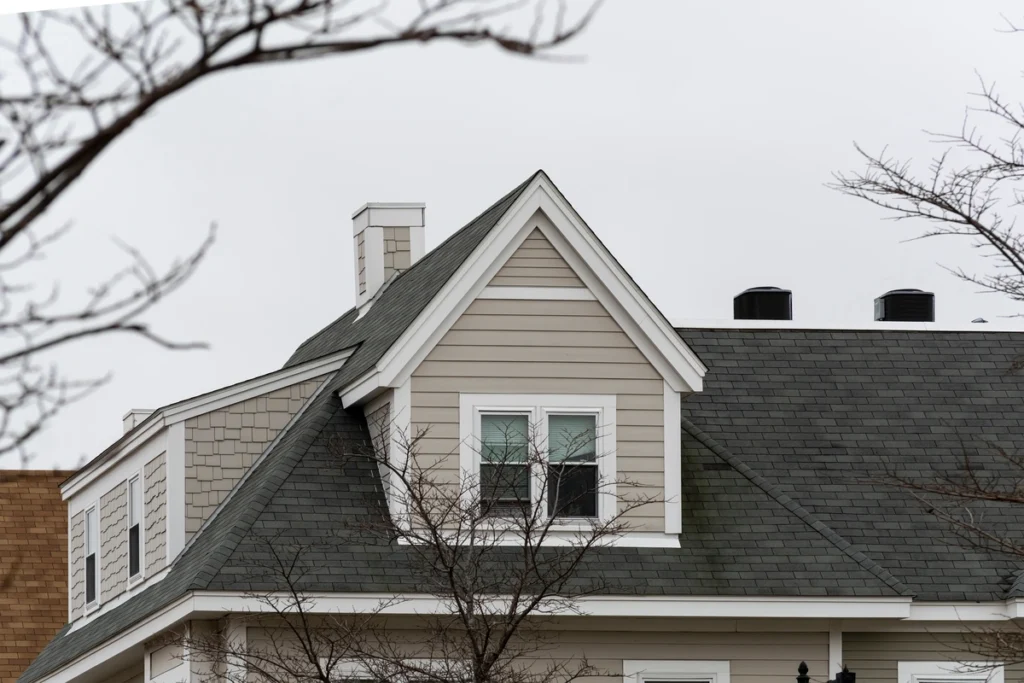 light colored home with dark asphalt shingles